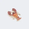 Broche em metal com strass, vermelho escuro Broche em metal com strass, vermelho escuro