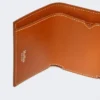 Carteira de couro com três dobras, cor ferrugem Carteira de couro com três dobras, cor ferrugem