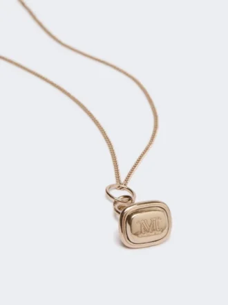 Colar comprido com pendente em forma de selo, dourado