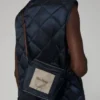 Colete acolchoado em lona de nylon repelente à água, azul-escuro Colete acolchoado em lona de nylon repelente à água, azul-escuro